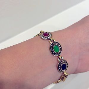 Multicolor stone bracelet in matt gold finish likely vintage